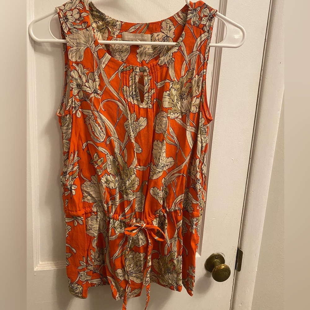 Women’s sleeveless peplum style blouse